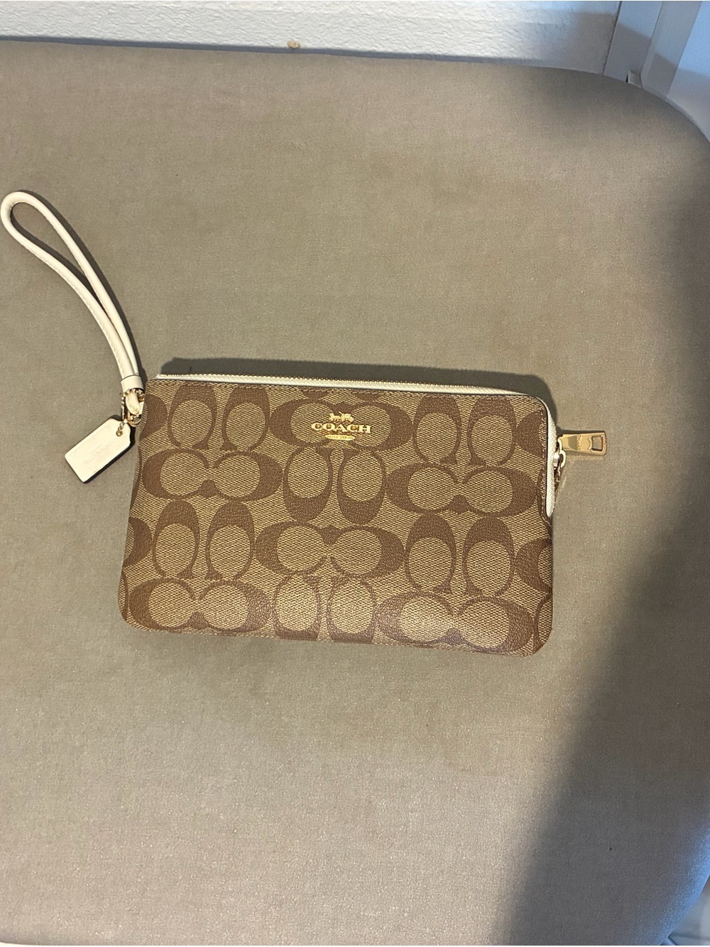 Coach Brown Signature Canvas Wristlet with Cream Strap